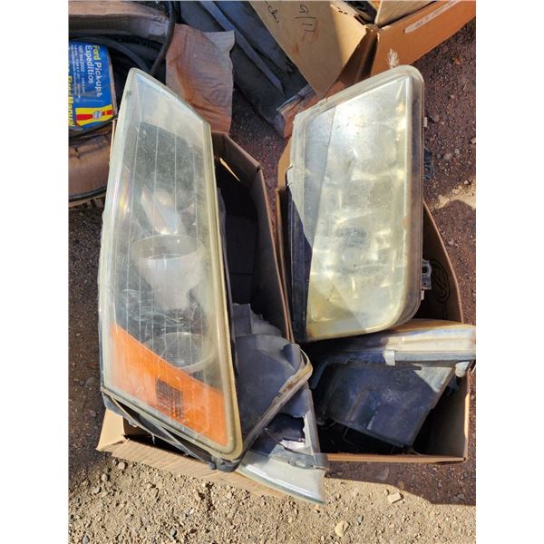 2 Boxes of Assorted Vehicle Headlights, Make/Model Unknown