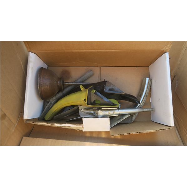 box of spouts and a small oiling can.