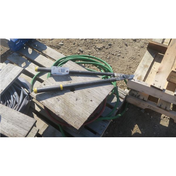Garden hose, prune shears, roll of air hose