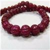 Image 1 : 430 CTS CARVED GLASS FILLED ENHANCED RUBY STRAND 18-11 MM - TEMPORARY CLASP