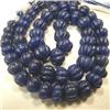 Image 1 : 452 CTS CARVED GLASS FILLED COLOR ENHANCED SAPPHIRE STRAND 16-7 MM - 16 INCHES - TEMPORARY METAL CLA