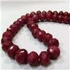 Image 1 : 711 CTS FACETED GLASS FILLED ENHANCED RUBY STRAND 11-11 MM