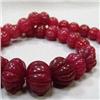 Image 1 : 485 CTS CARVED GLASS FILLED ENHANCED RUBY STRAND 18-10 MM - TEMPORARY CLASP