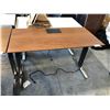 Image 2 : HERMAN MILLER WALNUT 60" X 30" ELECTRIC SIT/STAND PROGRAMMERS TABLE
