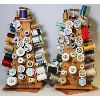 Image 1 : PAIR OF SPINNING SEWING THREAD HOLDERS WITH THREADS