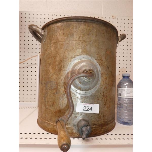 Antique metal butter churn