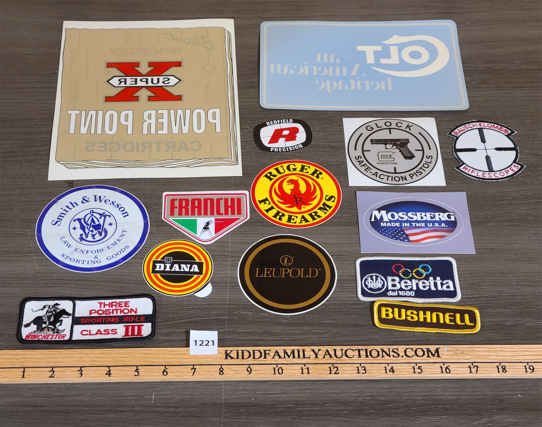 LOT OF 14 - FIREARMS DECALS AND CRESTS - Kidd Family Auctions