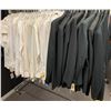 Image 1 : "Superheroes Show" - Rack full of black suit jackets/ black pants/ cream long sleeve button shirts &