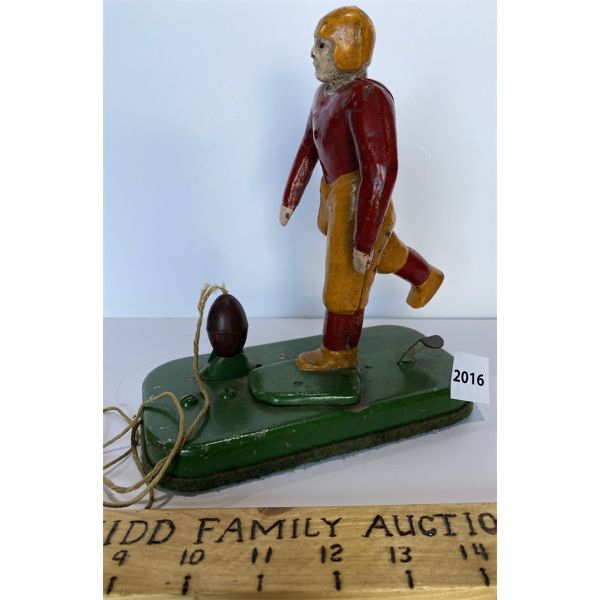 CAST IRON MECHANICAL FOOTBALL KICKER TOY