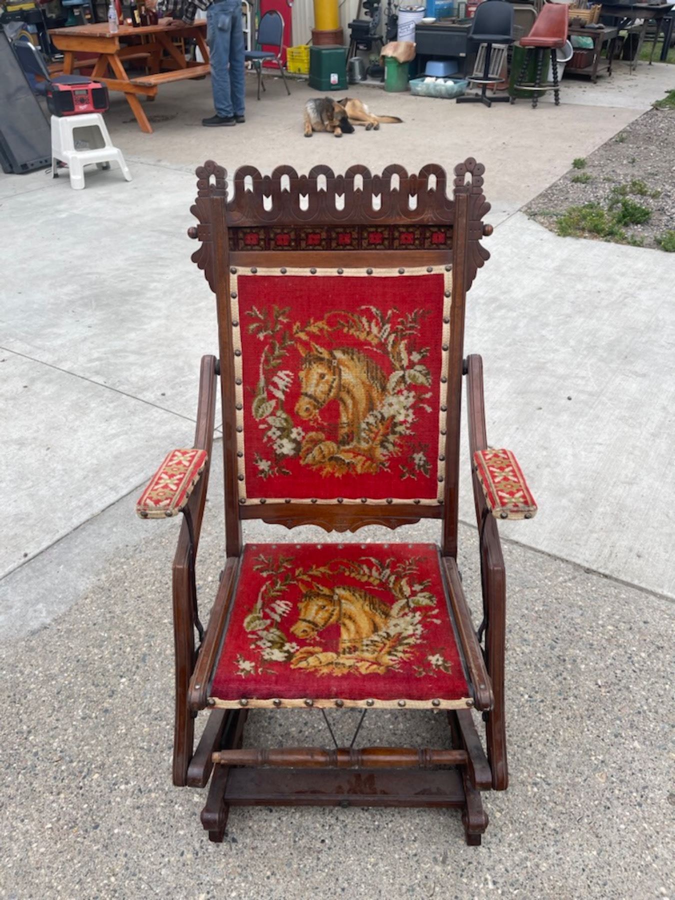 VINTAGE CARVED ROCKING CHAIR WITH EMBROIDERED HORSE UPHOLSTERY