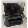 Image 1 : Emerson LC320EM2 32" Television, Sony DVP-SR200P CD/DVD Player, and TV Stand