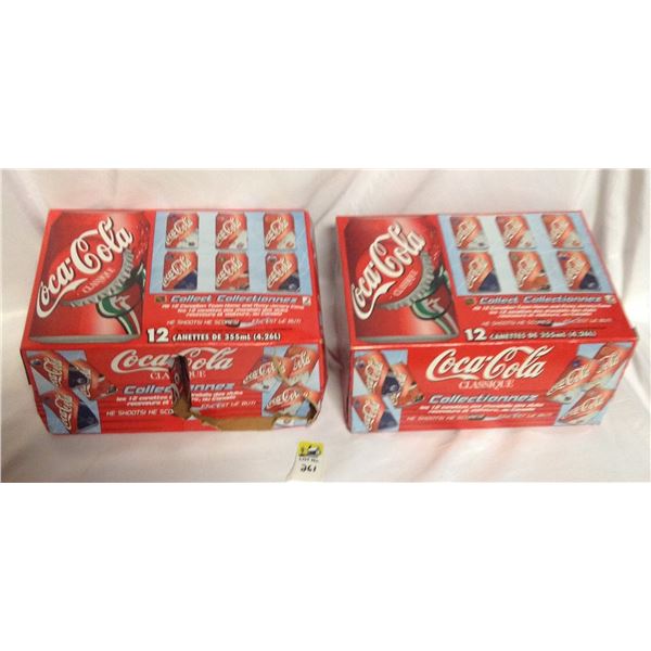 Two coca cola boxes and 24 cans