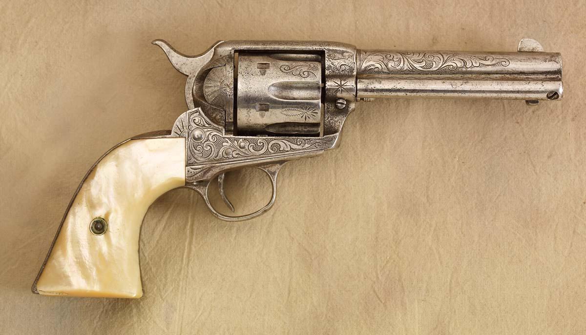 Engraved Colt .45 with Pearl Grips and Tooled Leather Gun Rig
