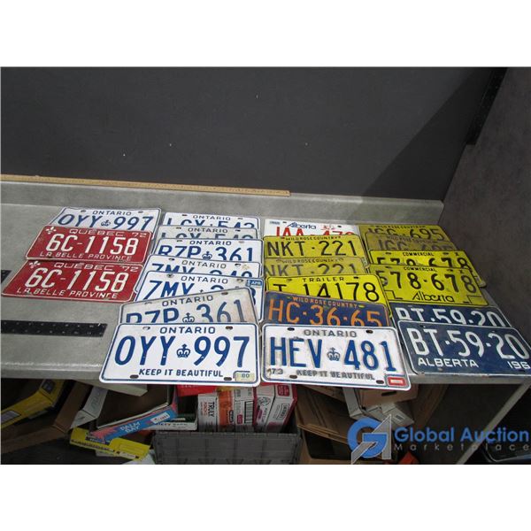 (22) Assorted Vintage Alberta, Ontario and Quebec license Plates