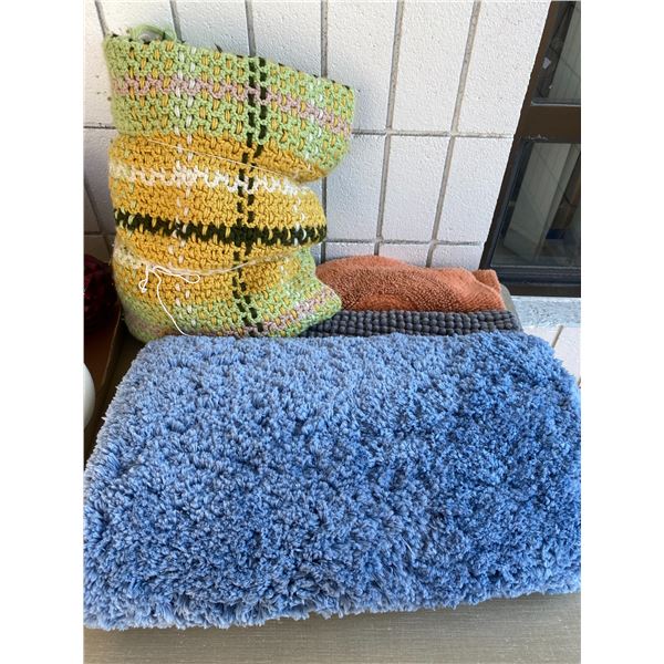 3 bath mats and homemade blanket