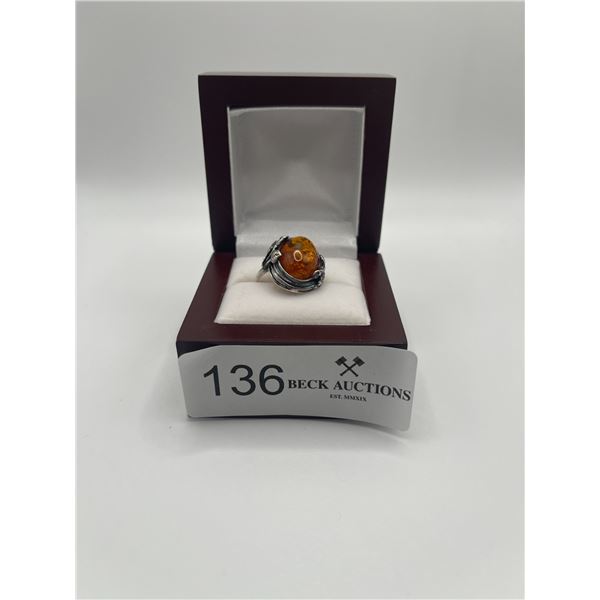 Sterling Silver set with large amber cabachon. Stamped 925 Size  9