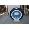 Image 1 : BF Goodrich tire stand with display tire + dodge hubcap