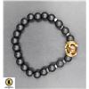 Image 1 : #99- NATURAL BLACK FROSTED CROWN TIGER EYE BRACELE
