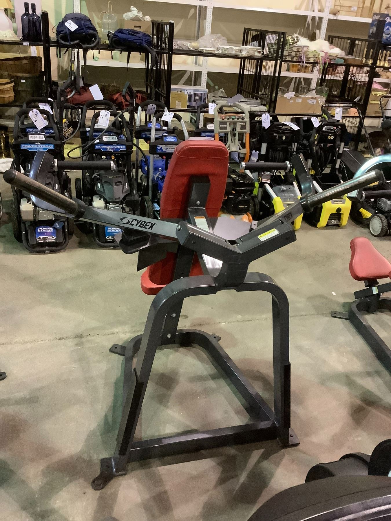 CYBEX CONVERGING PLATE LOADED OVERHEAD PRESS MACHINE Cybex converging plate loaded overhead press machine
