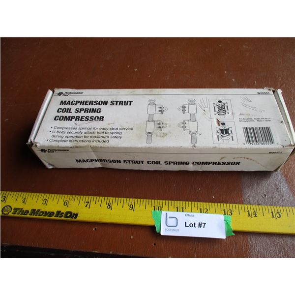 Coil spring strut compressor