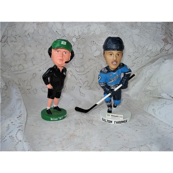 pair of sports bobble head collectibles