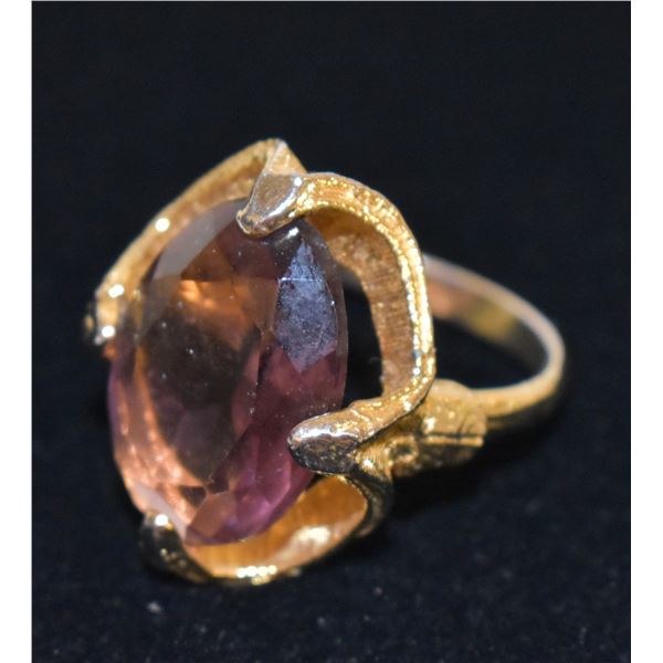 GOLD TONE RING WITH LARGE PURPLE STONE