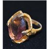 Image 1 : GOLD TONE RING WITH LARGE PURPLE STONE