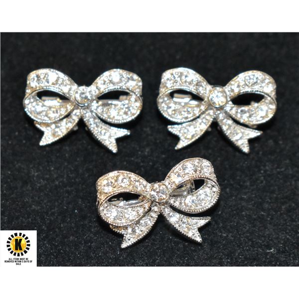 THREE SILVER TONE BOW PINS