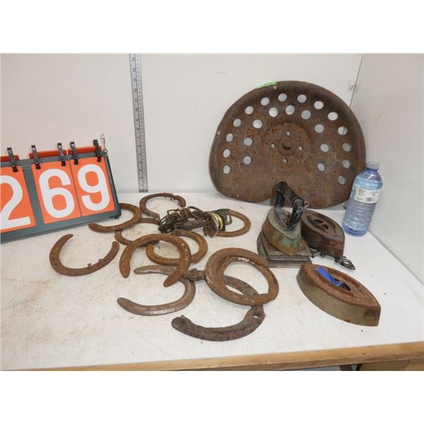 tractor seat, horsehoes, antique irons