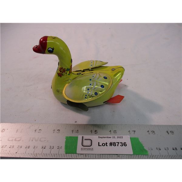 Vintage tin toy duck with windup key