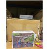 Image 8 : SHELF OF BOXES OF LARGE AC FIDGET TOYS, SAVINGS BANKS, TRAMPOLINE SPRAYERS & TOY BOWS