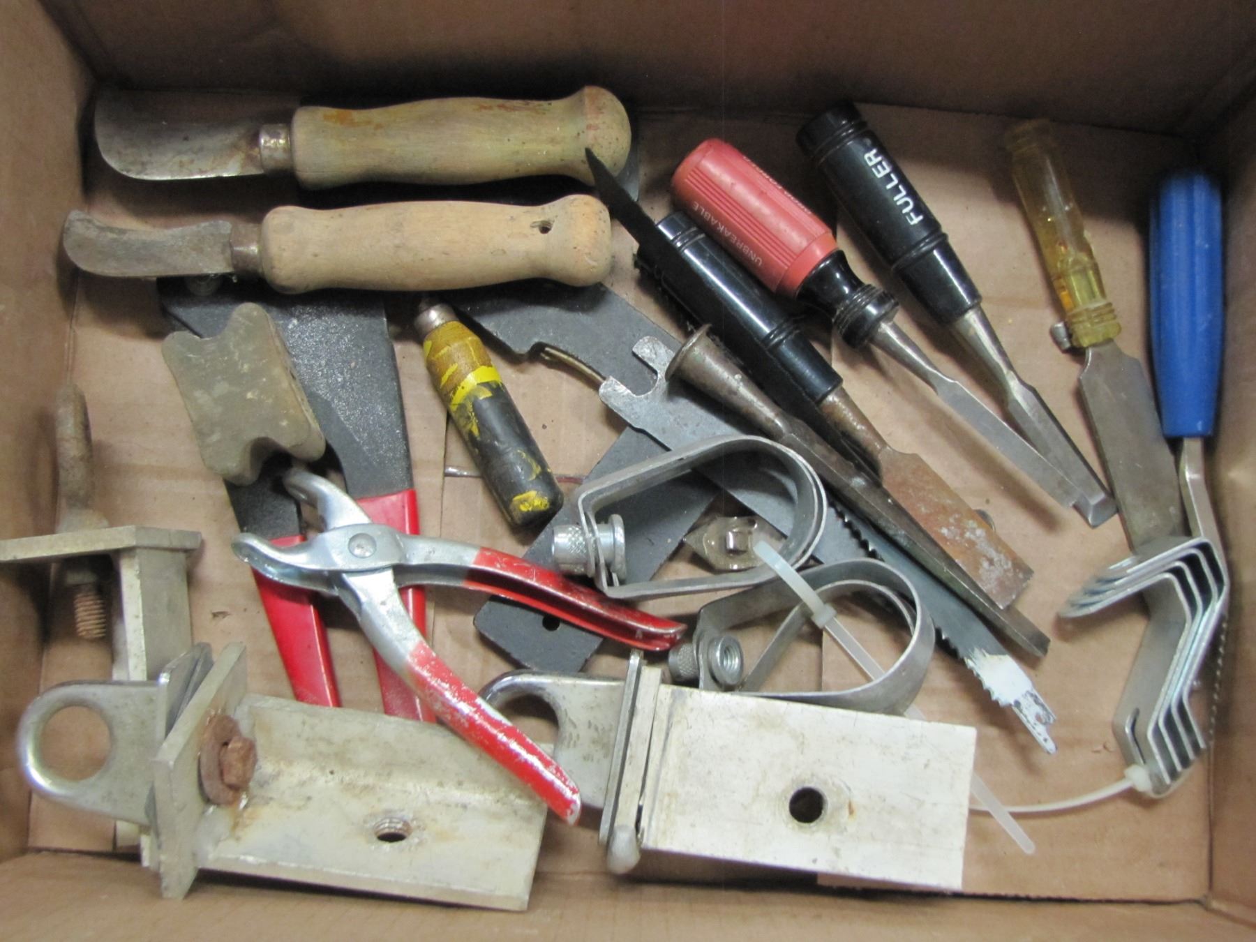 Box with wood chisels etc