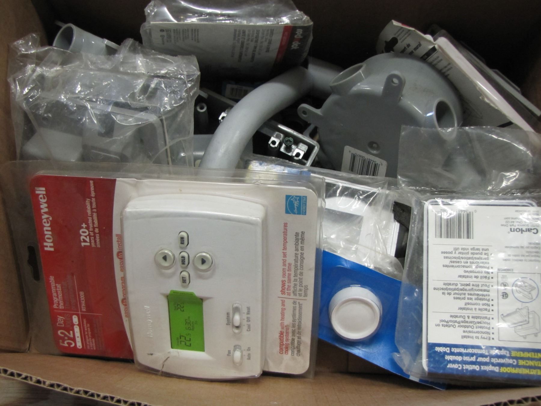 Box with Honeywell thermostat and electrical boxes etc