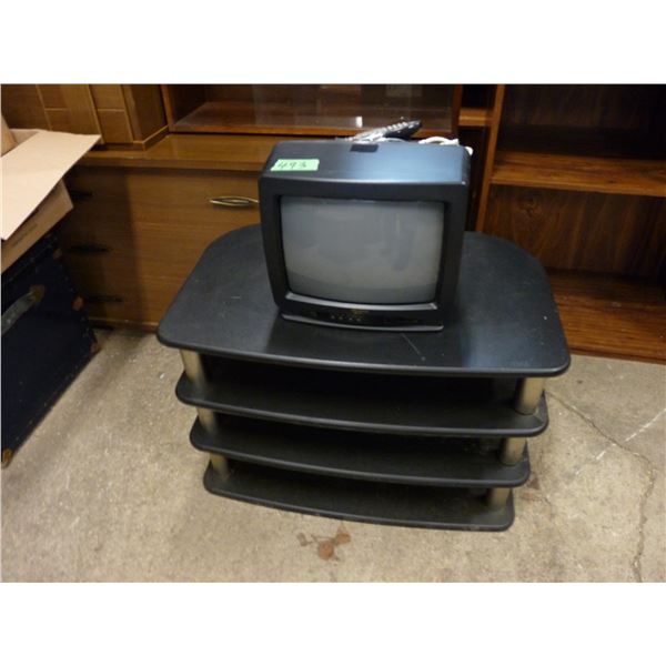 Television stand with small Memorex TV with remote