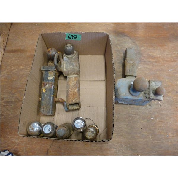 Lot of trailer hitches and balls