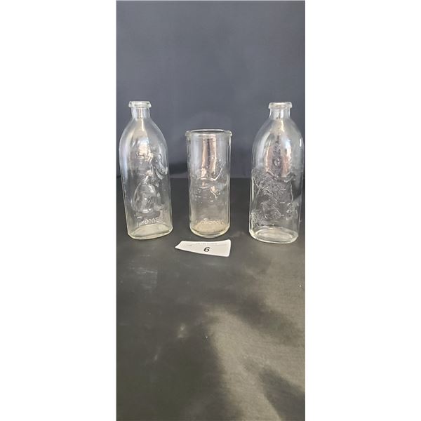 THREE 1940'S BEAUTIFULLY EMBOSSED GLASS BABY BOTTLES
