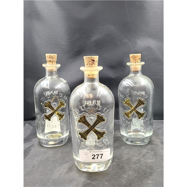 THREE BUMBU EMBOSSED RUM BOTTLES