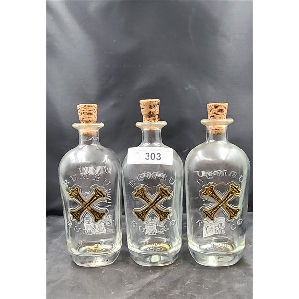 THREE BUMBU EMBOSSED RUM BOTTLES