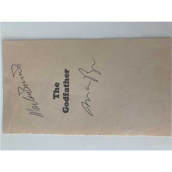 Mario Puzo and Marlon Brando The Godfather signed book page. GFA Authenticated