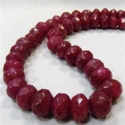 715 CTS FACETED GLASS FILLED ENHANCED RUBY STRAND 14-12 MM