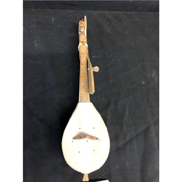 A SINGLE-STRINGED BOWED INSTRUMENT, ELABORATELY HAND-CARVED BODY WITH A ...