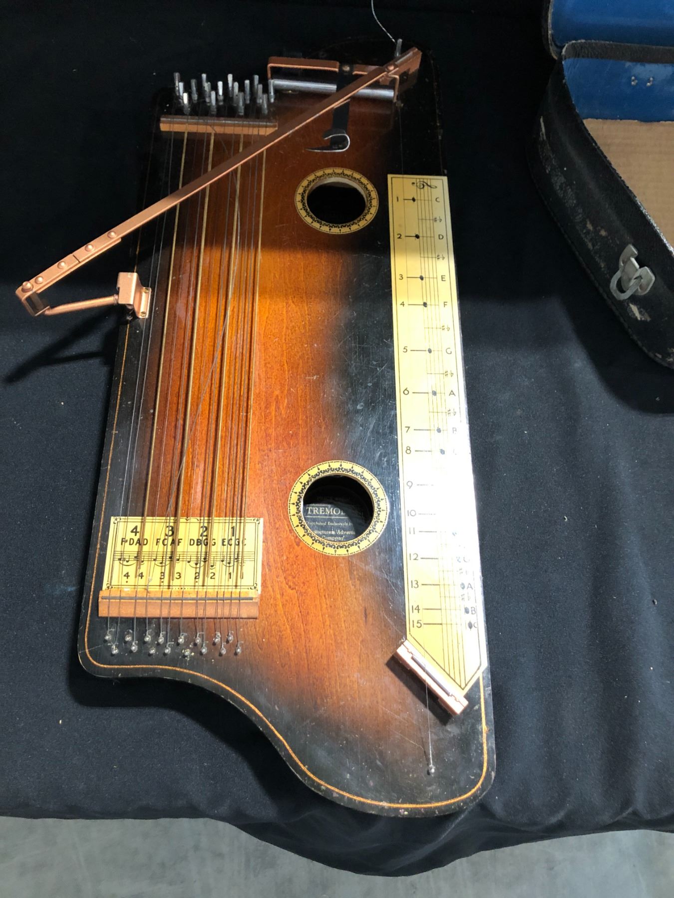 ANTIQUE HAWAIIAN TREMOLOA IN ORIGINAL CASE. INCLUDES BOOK OF SHEET ...