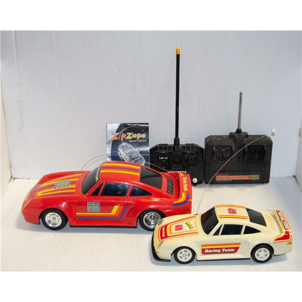 PAIR OF VINTAGE PORSCHE REMOTE CONTROL CARS