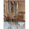 Image 2 : WALL OF ASSORTED POLE CLAMPS, C-CLAMPS, F-CLAMPS AND SLEDGE HAMMERS