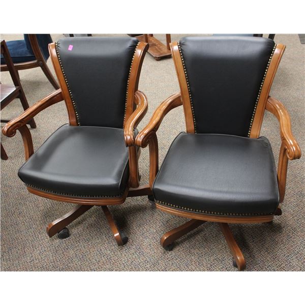 SHOWROOM PAIR OF CALIFORNIA HOUSE ROLLING PARLOUR CHAIRS; BLACK STUDDED/ LIGHT BROWN WOOD FINISH