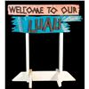 Image 1 : "WELCOME TO OUR LUAU" OA LUAU RENTAL DEPARTMENT FLOOR SIGN.