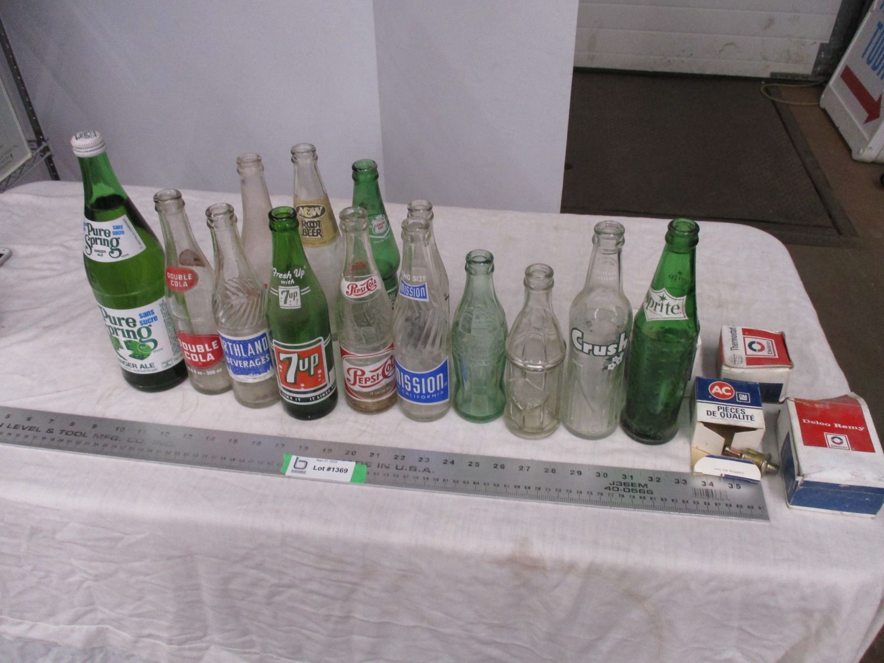 Box of pop bottles - pure springs sealed - Bodnarus Auctioneering