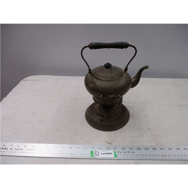 Copper kettle on stand with burner on bottom