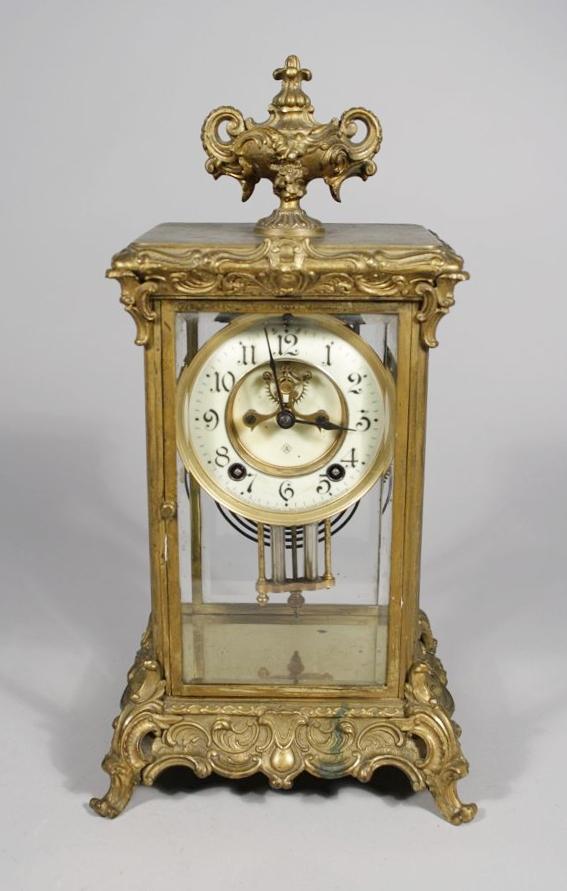 An Ansonia Gilt Brass and Glass Mantle Clock.