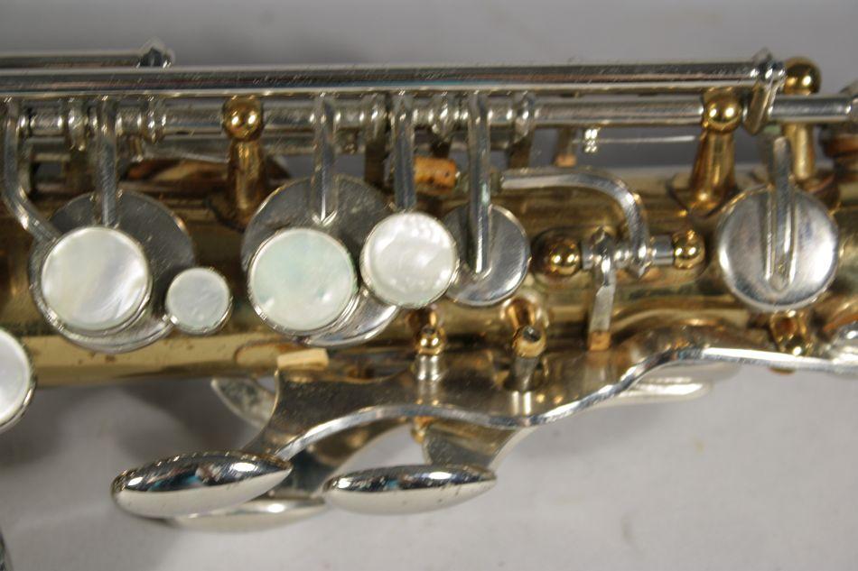 A Selmer Bundy II Brass and Chrome Alto Saxophone.